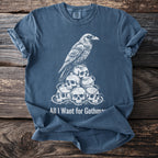 All I Want for Gothmas shirt features a raven on a pile of skulls.