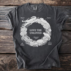 T-shirt graphic with "Love the Unloved" text and labeled reptiles in a circular design.