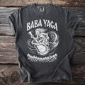 Baba Yaga rides a broomstick and pestle through a swirling vortex above a forest.