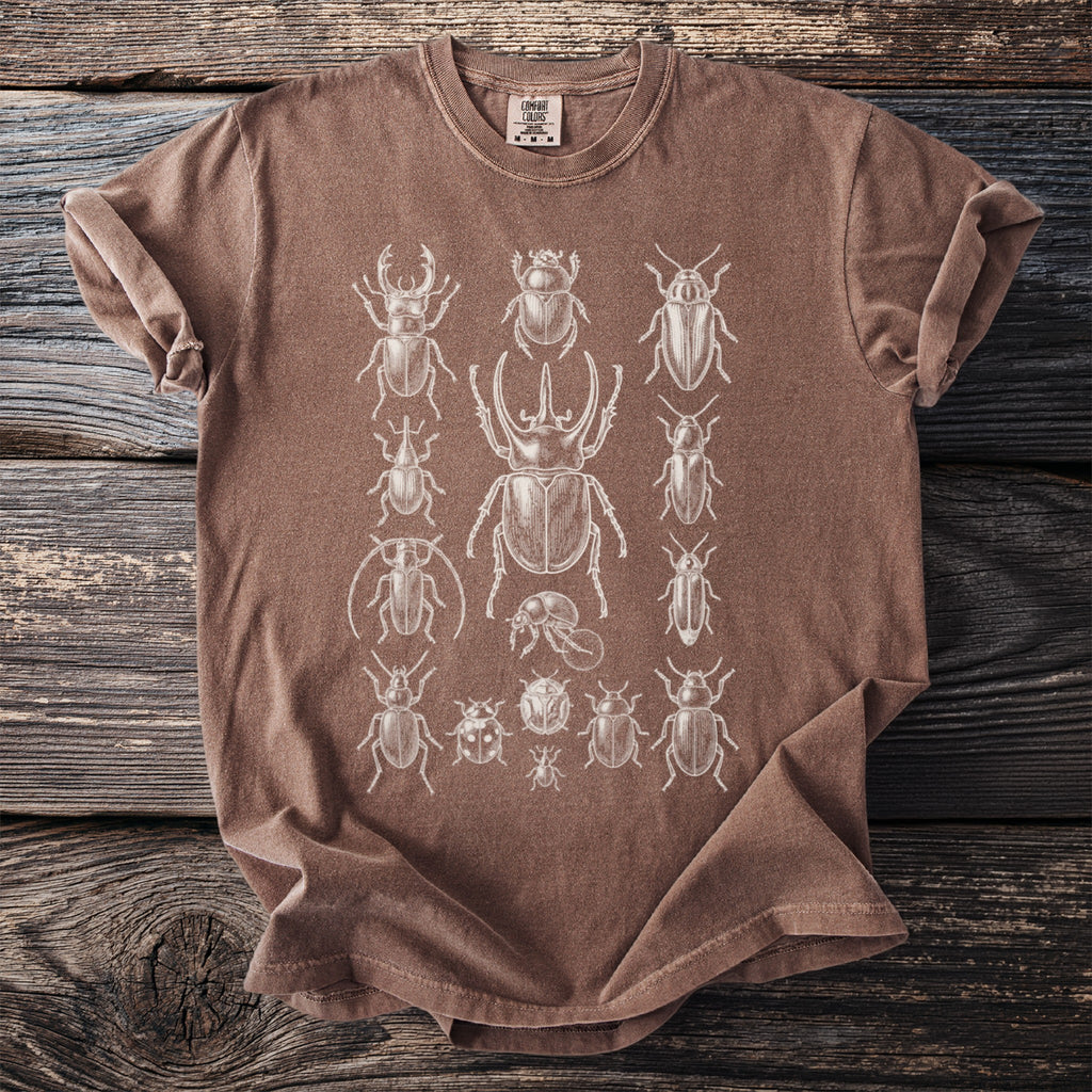 Brown t-shirt with white vintage beetle illustrations.