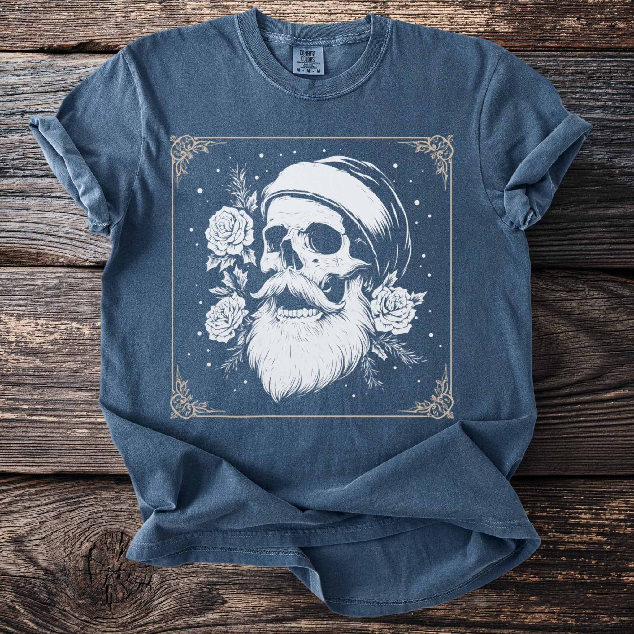 Blue t-shirt with skull, beard, mustache, and roses graphic in ornate frame.