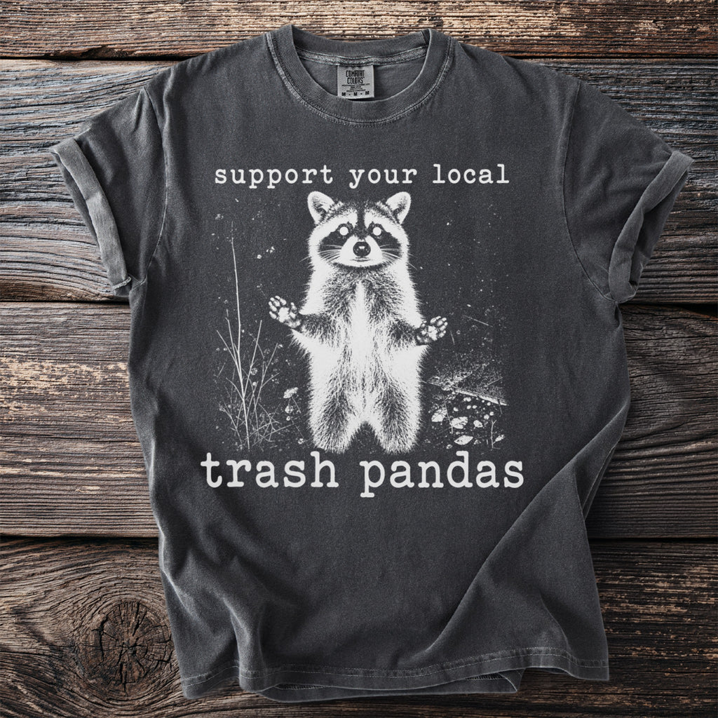 Dark gray t-shirt with white raccoon graphic and text "support your local trash pandas".