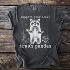 Dark gray t-shirt with white raccoon graphic and text "support your local trash pandas".