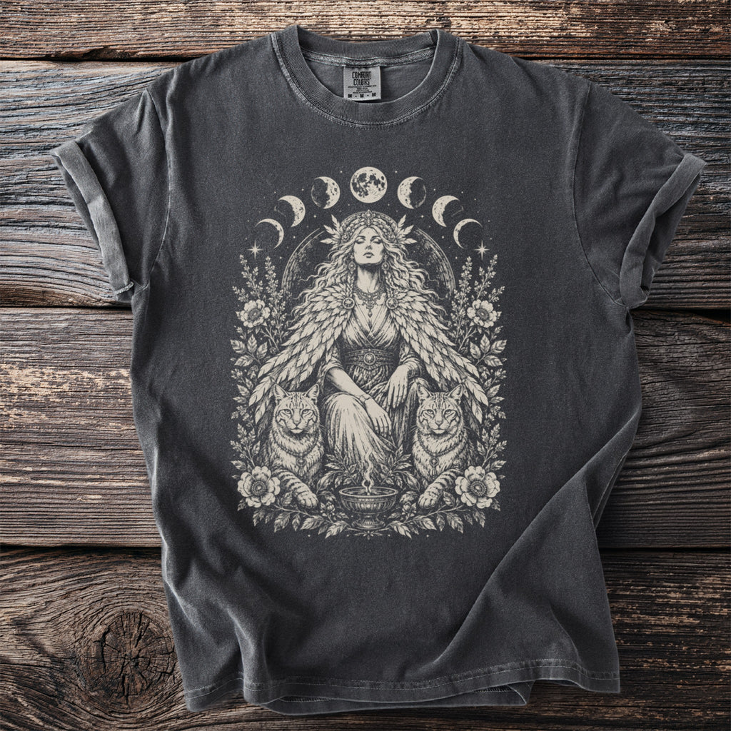 T-shirt with a mystical goddess, two cats, floral motifs, and moon phases illustration.