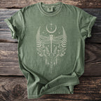 Green t-shirt with a central cream-colored dragonfly and celestial botanical design.