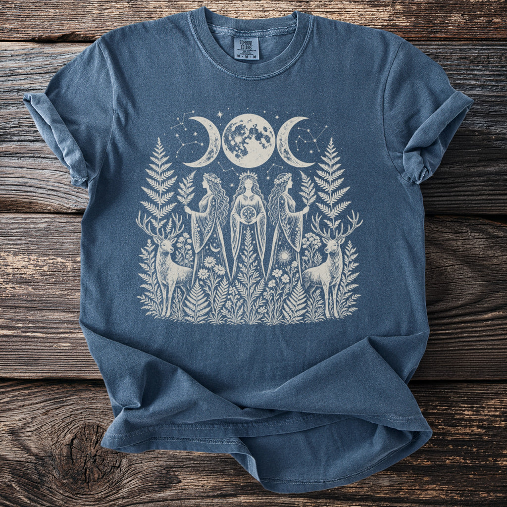 Blue t-shirt with white celestial women, deer, and botanical print.