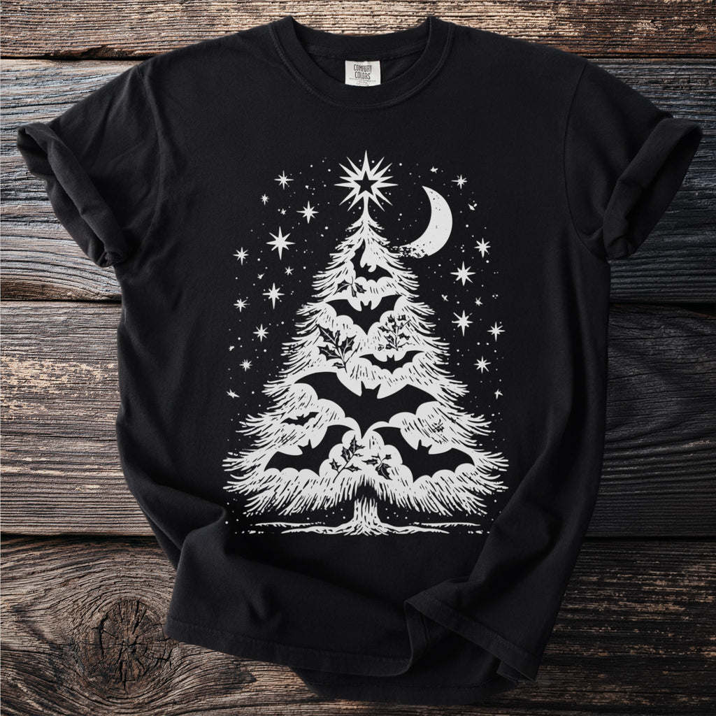 Black t-shirt with white Christmas tree design featuring bats and celestial elements.