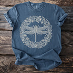 Dark blue t-shirt with cream dragonfly and floral wreath design.