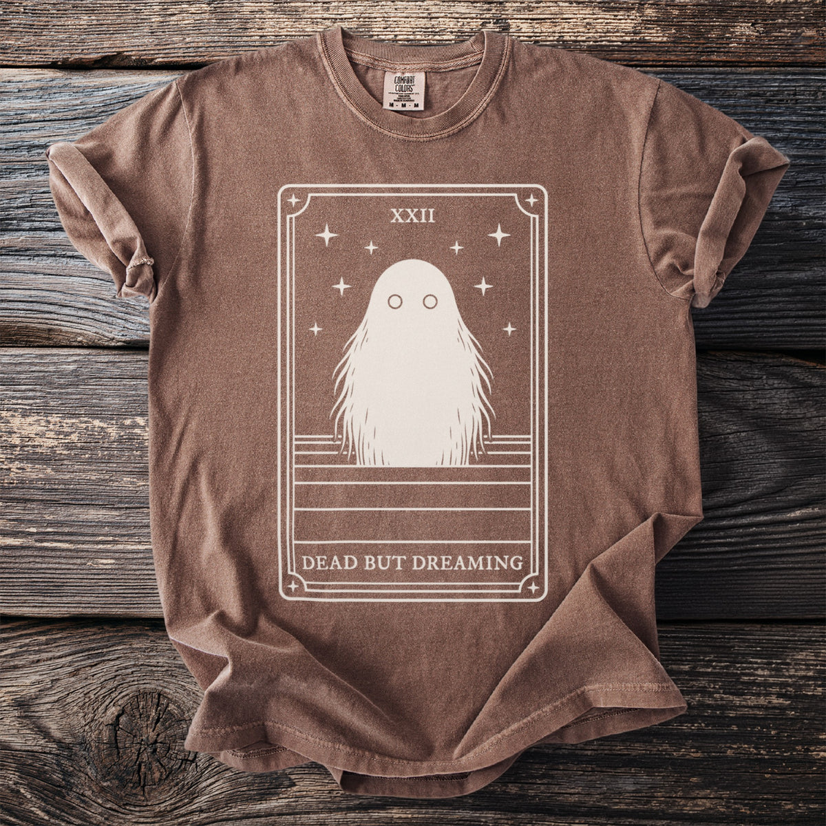 Brown t-shirt with a white graphic of a ghost in a tarot card frame.