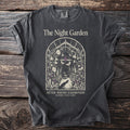 Dark grey t-shirt with "The Night Garden" graphic and text.