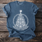 Blue t-shirt with white graphic of a skull tree, candles, and "DARK TIDINGS" text.