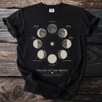 Black t-shirt showing the phases of the moon with text "Phases of the Moon".