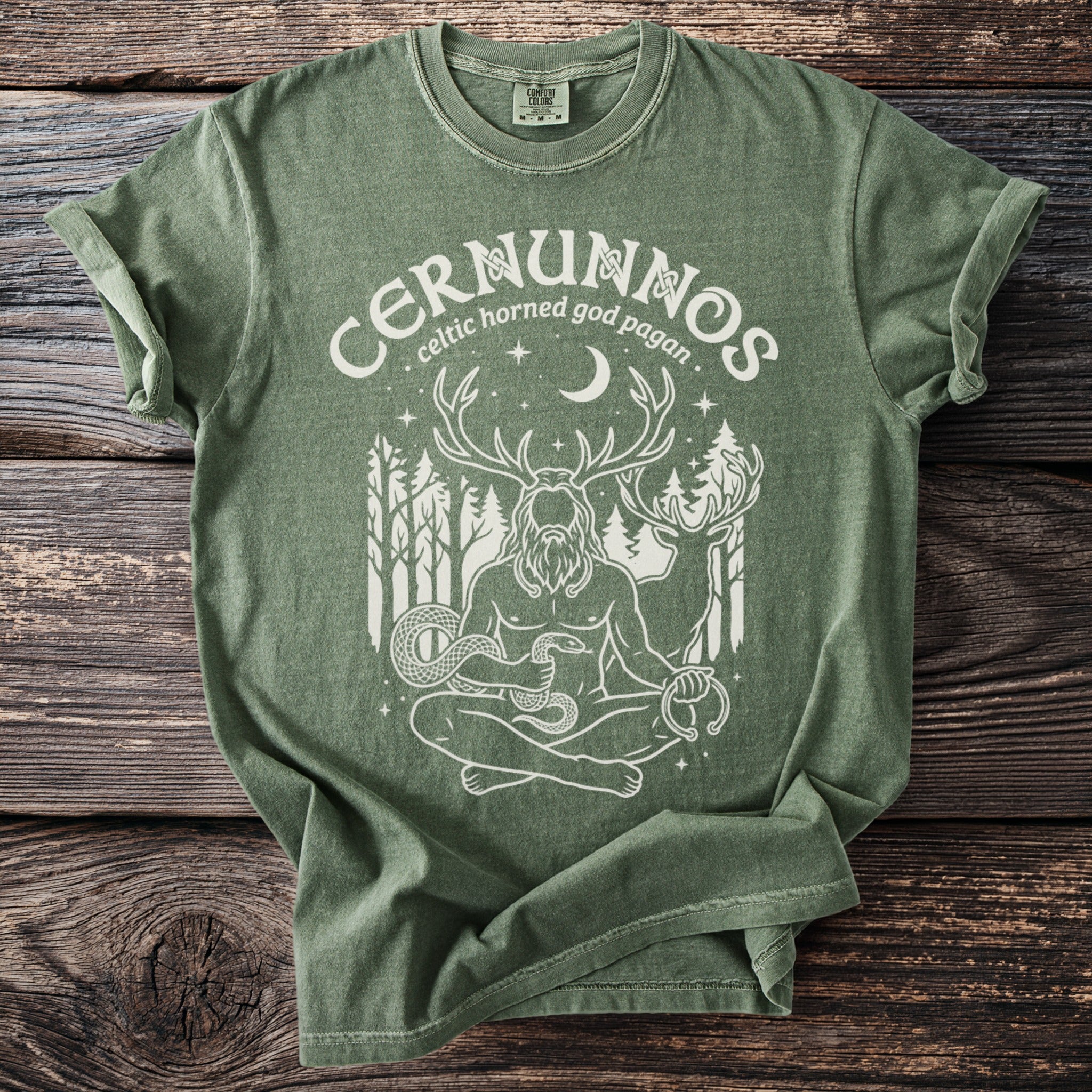 Green t-shirt with white graphic of Cernunnos, Celtic horned god, and wildlife.