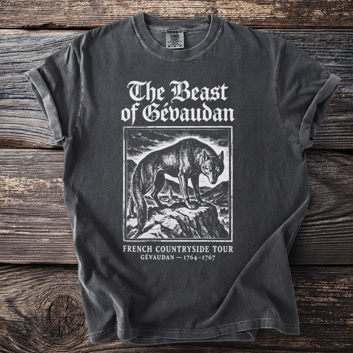 T-shirt with "The Beast of Gévaudan" text and a wolf illustration.
