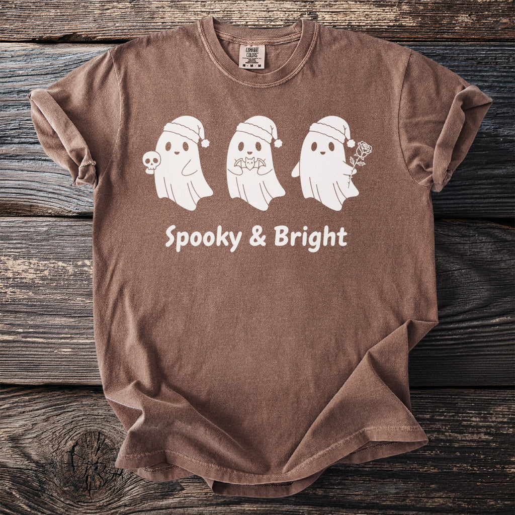 Brown t-shirt with three white ghosts in Santa hats, "Spooky & Bright" text.