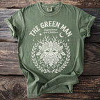Green t-shirt with white "The Green Man" text and pagan forest spirit folklore artwork.