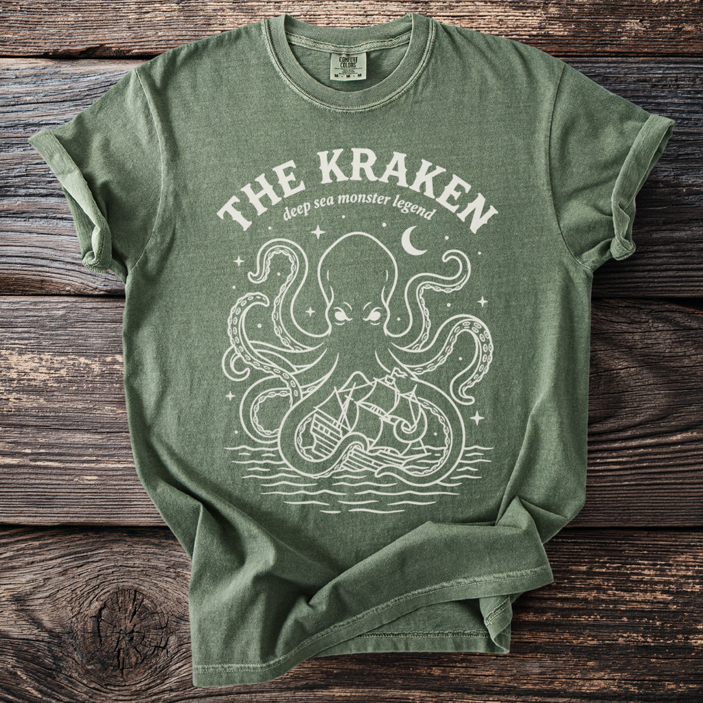Green t-shirt with white graphic of The Kraken legend and pirate ship.