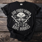 Black t-shirt with "God Forbid Women Have Hobbies" text and moth skull graphic.