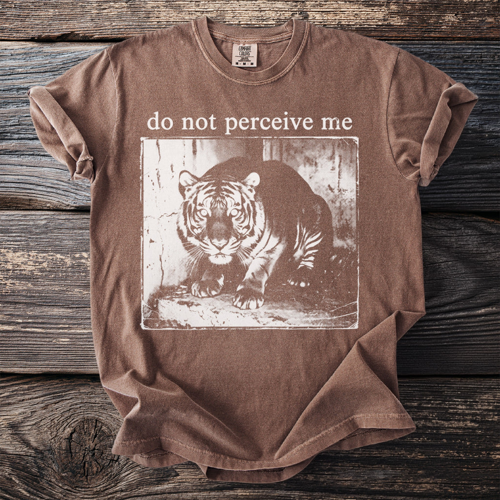 Brown t-shirt with a distressed tiger graphic and "do not perceive me" text.