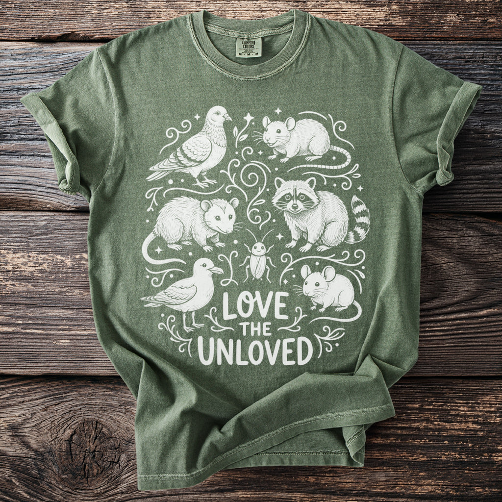 Green t-shirt with "Love the Unloved" text and sketch drawings of various animals.