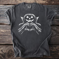 Dark t-shirt with a white graphic of a jack-o'-lantern in a cape making a heart shape.