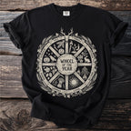 Black t-shirt with a cream-colored Wheel of the Year design and text.