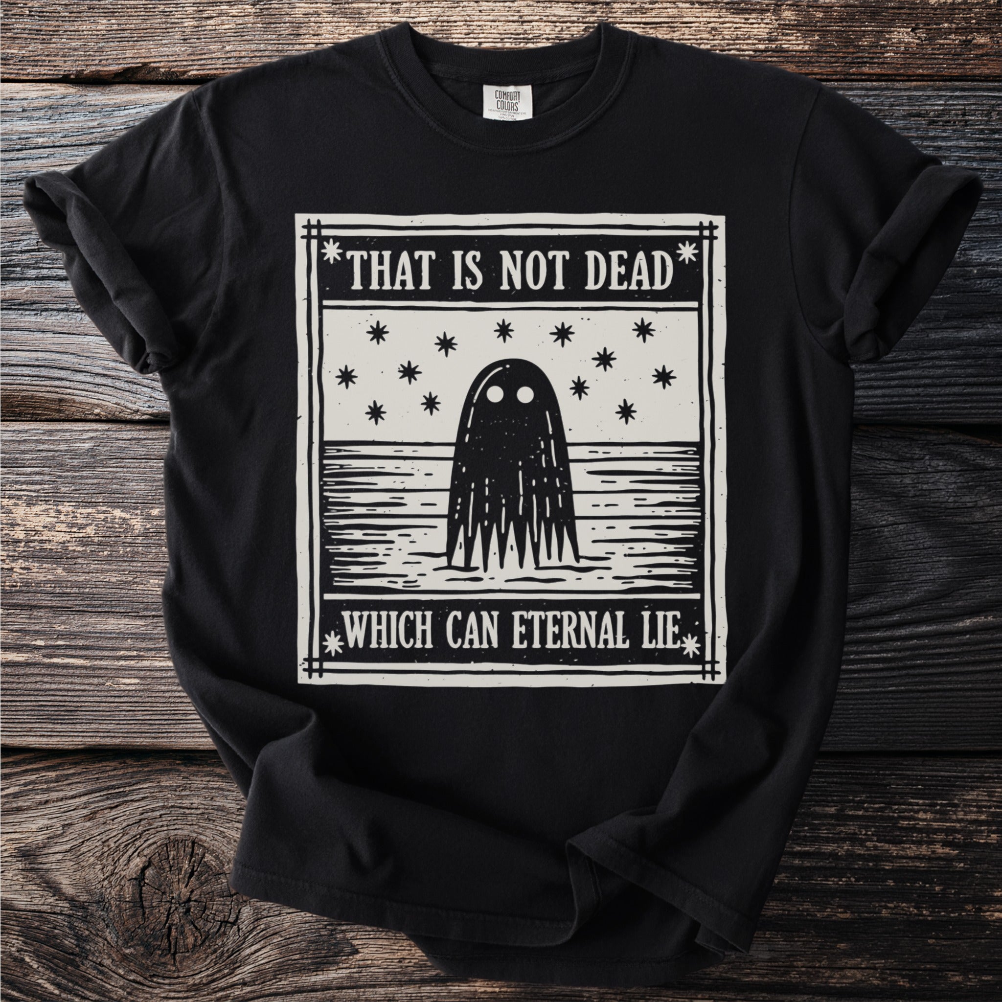 Black t-shirt with ghost graphic and text "THAT IS NOT DEAD WHICH CAN ETERNAL LIE."