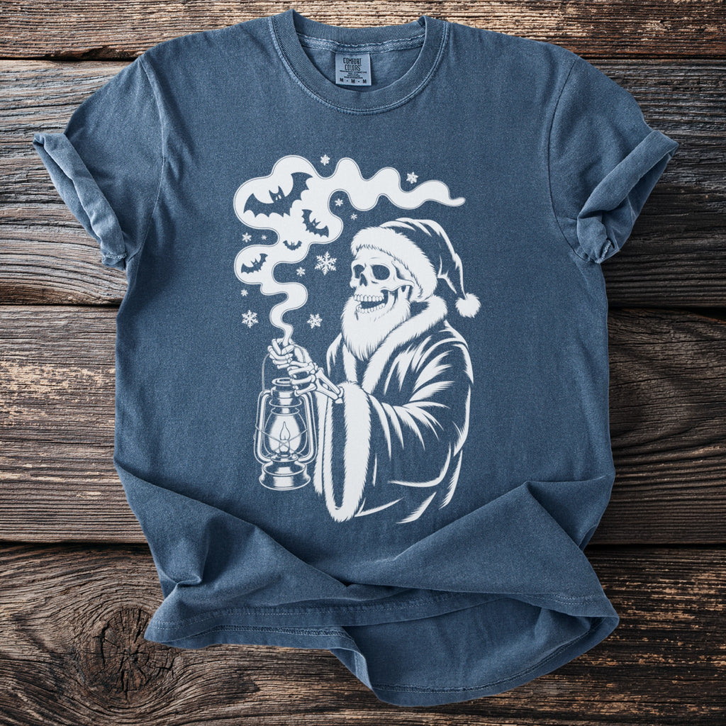 Skeleton in Santa hat with lantern and bats graphic on a blue t-shirt.