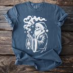 Skeleton in Santa hat with lantern and bats graphic on a blue t-shirt.