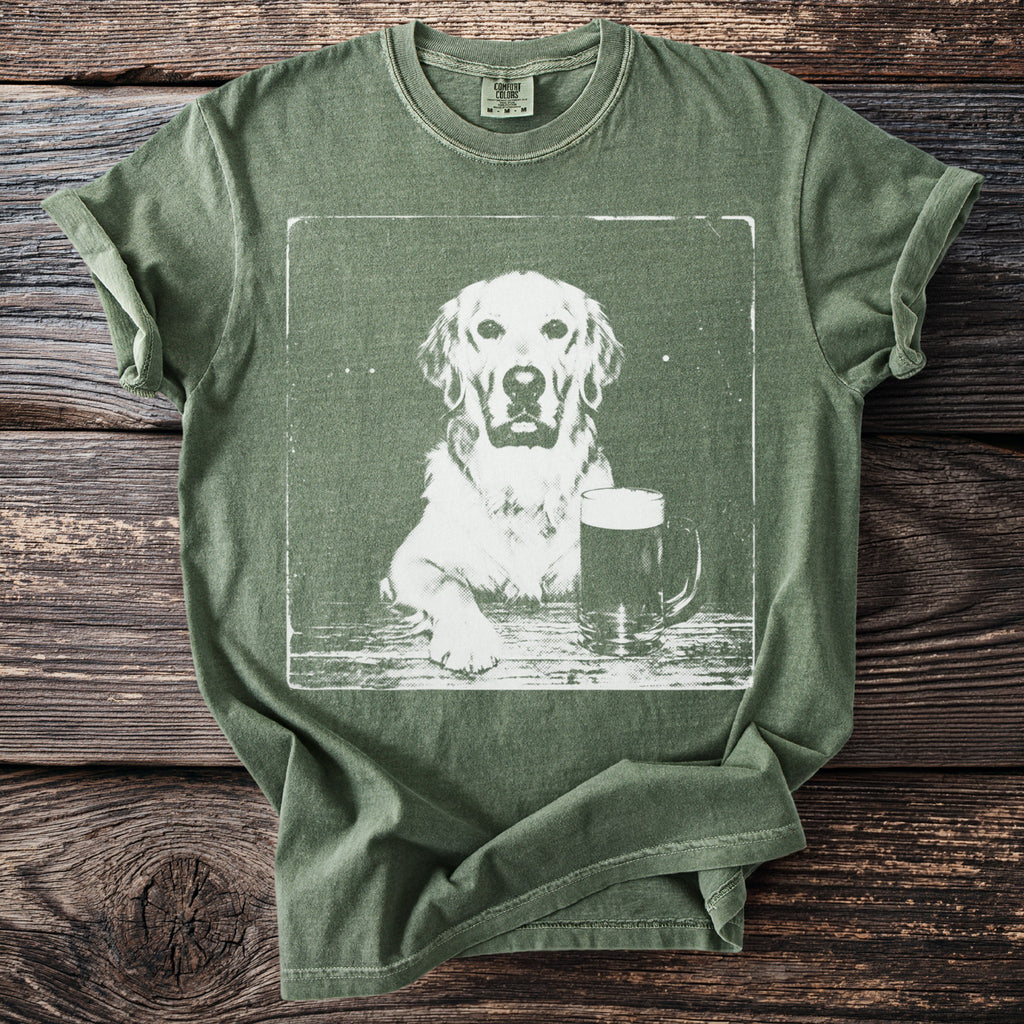 Green t-shirt graphic of a golden retriever with a pint of beer.