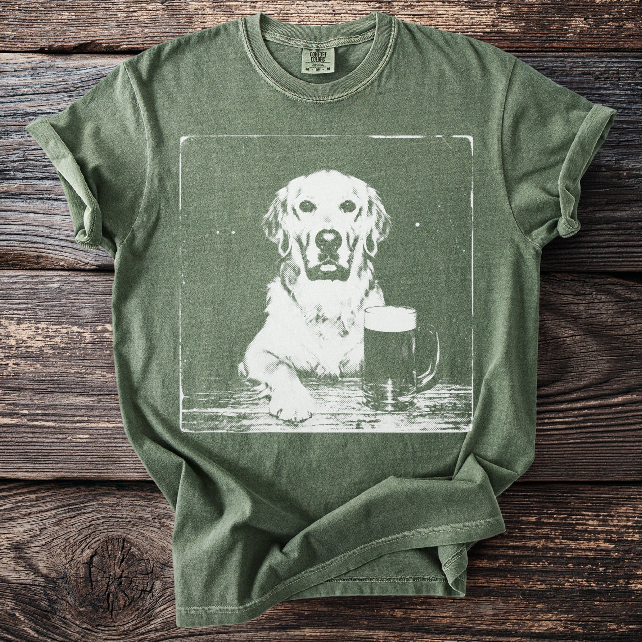 Green t-shirt graphic of a golden retriever with a pint of beer.