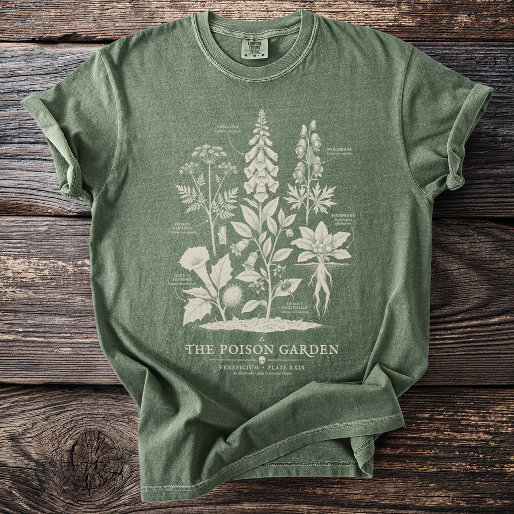 Green t-shirt with "The Poison Garden" text and botanical illustrations of poisonous plants.