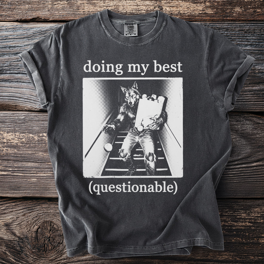 T-shirt graphic with werewolf carrying groceries down stairs, text "doing my best (questionable)".