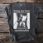 T-shirt graphic with werewolf carrying groceries down stairs, text "doing my best (questionable)".