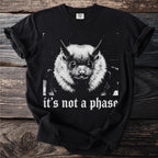 Black t-shirt with a close-up of a bat and "it's not a phase" text.