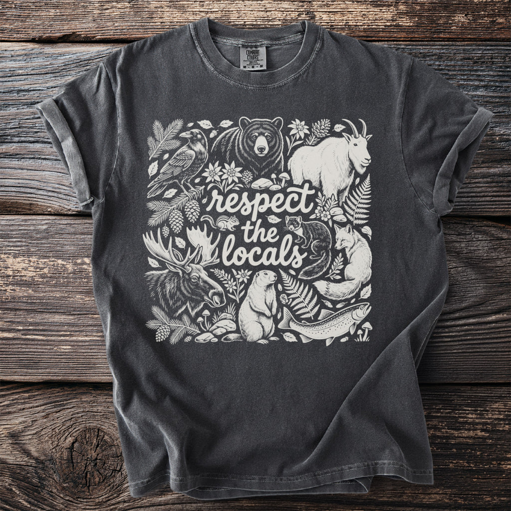 Dark grey t-shirt with white illustration of forest animals and text "respect the locals".
