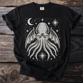 Black t-shirt with a white tentacled creature design featuring wings and celestial elements.
