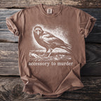 Brown t-shirt with crow print and "accessory to murder" text.