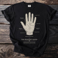 Black t-shirt with a diagram of a hand labeled "The Reader's Hand" and "Chiromancy Plate XXII".