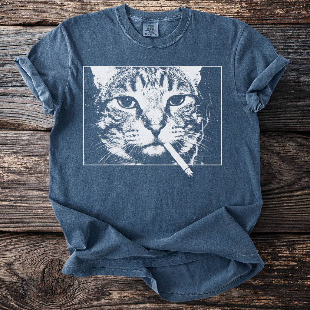 Blue t-shirt with white graphic of a cat smoking a cigarette.