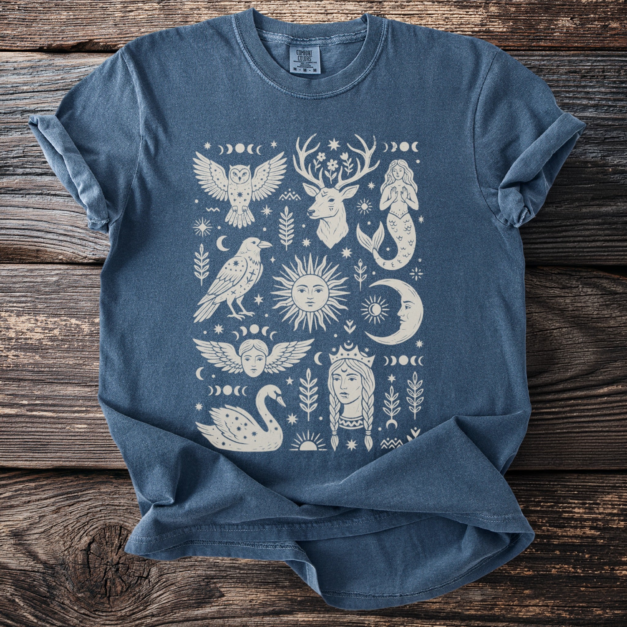 Blue t-shirt with mystical celestial and animal graphic print.