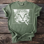 Green t-shirt with distressed print of a cat smoking a cigarette.