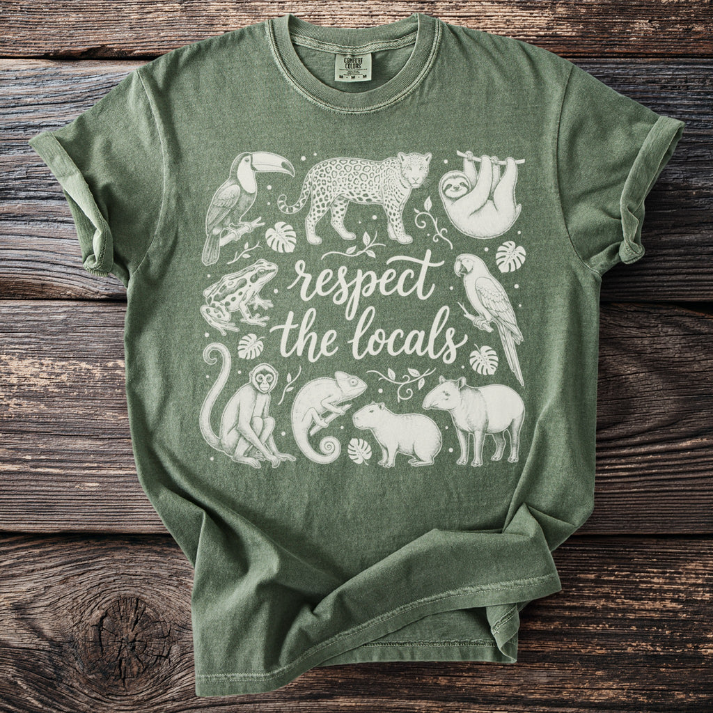 Green t-shirt with white line drawings of animals and text "respect the locals".