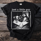 Black t-shirt with "just a little guy" text over wolf in a box graphic.