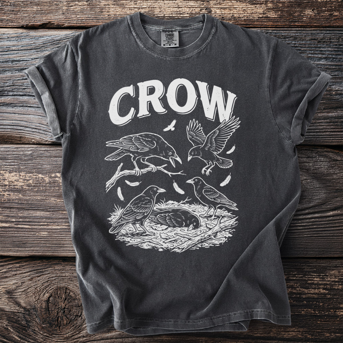 Dark grey t-shirt with white graphic of the word "CROW" and four crows.