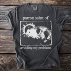 Dark gray t-shirt with "patron saint of" and an opossum graphic: "avoiding my problems".