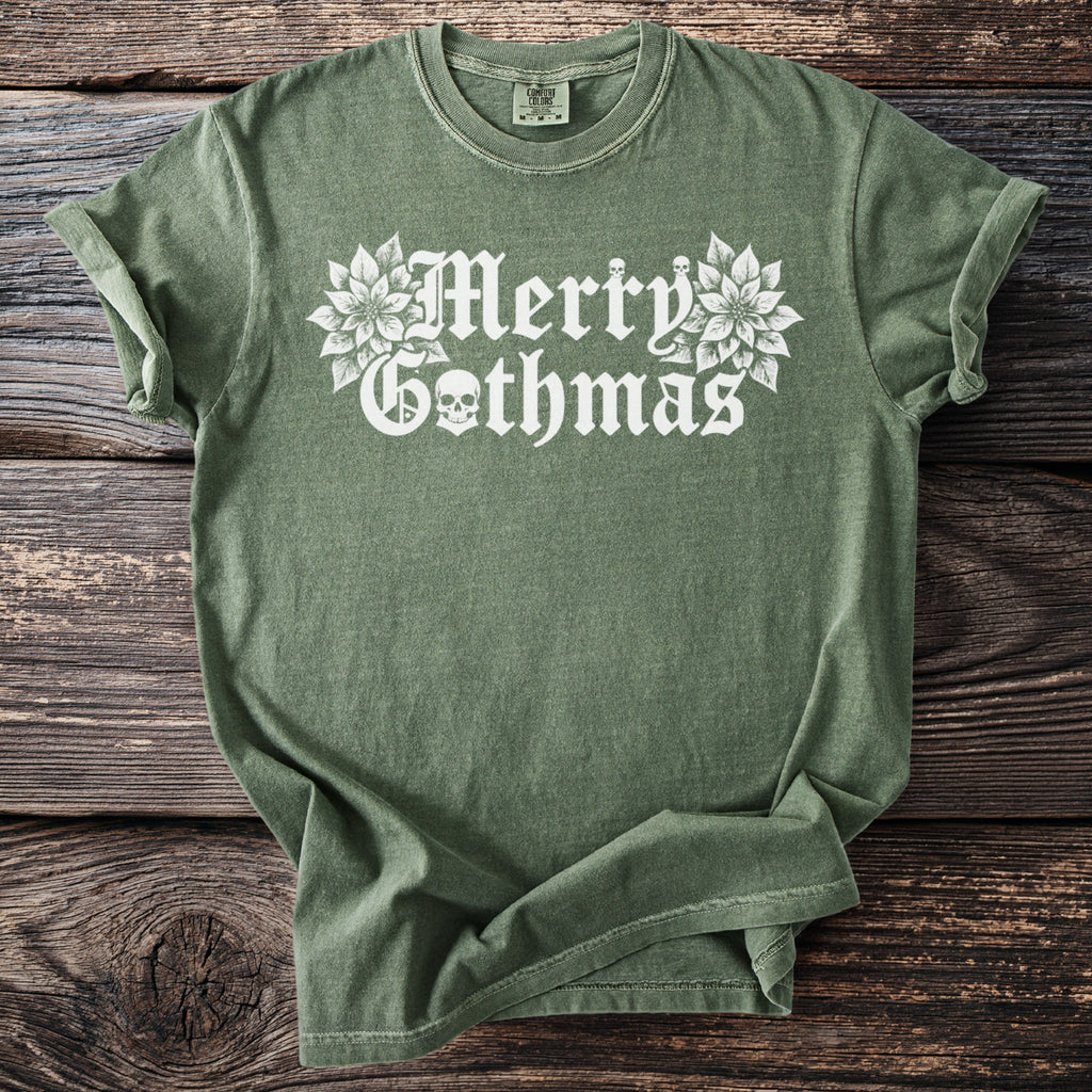 Green t-shirt with white "Merry Gothmas" text, skulls, and poinsettias.