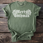 Green t-shirt with white "Merry Gothmas" text, skulls, and poinsettias.