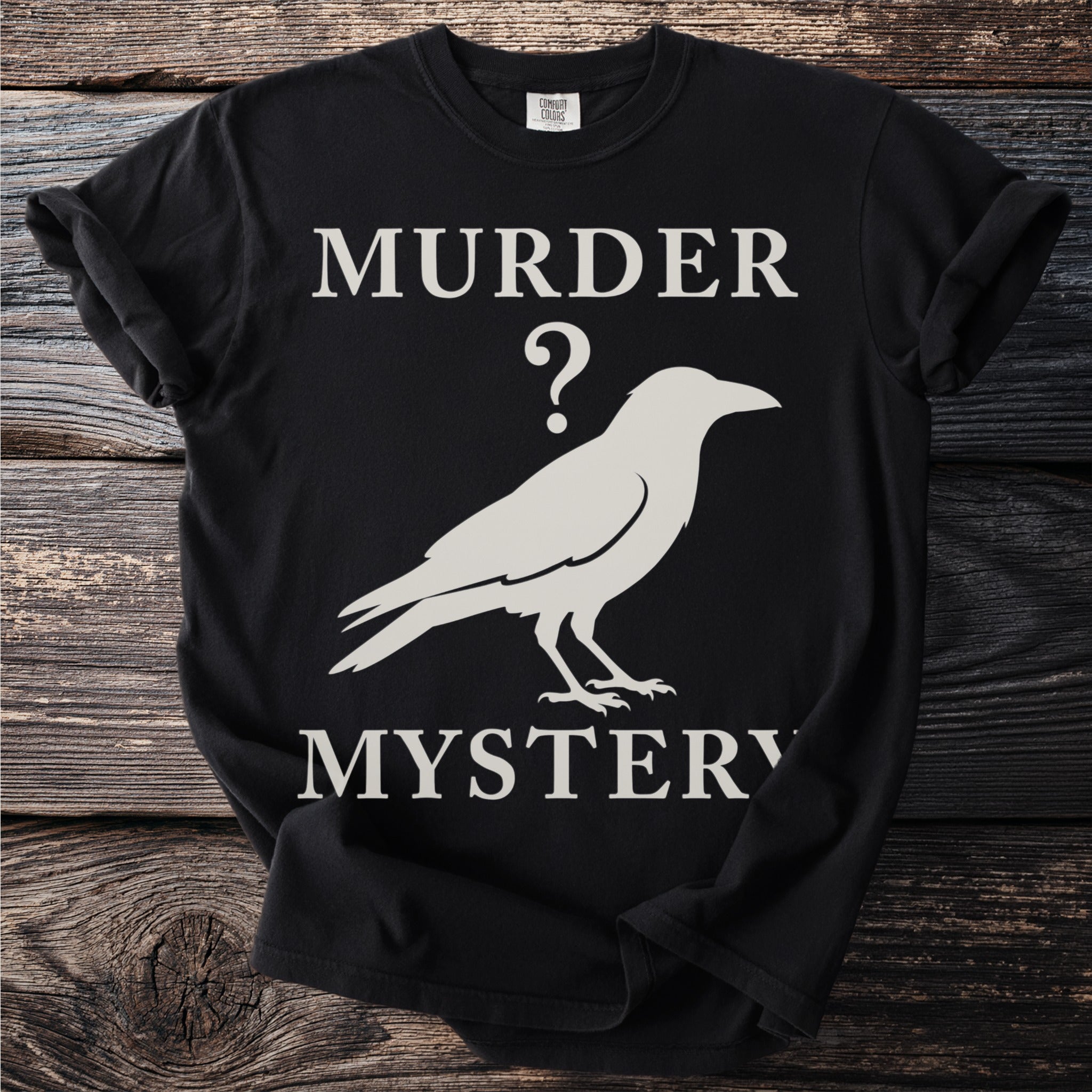 Black t-shirt with "Murder?" and a crow silhouette above "Mystery".