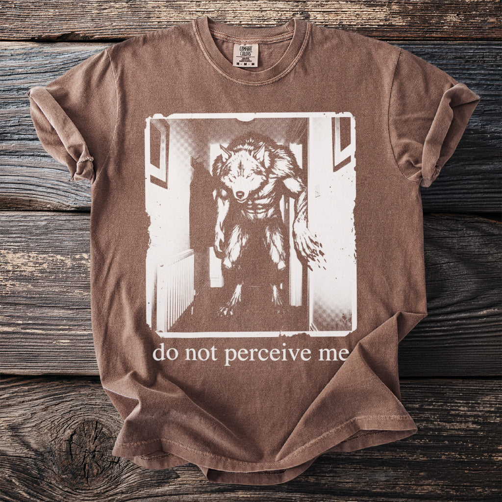 Brown t-shirt with a werewolf graphic and the text "do not perceive me".